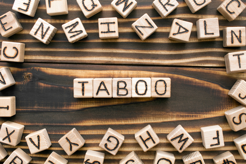 Taboo - word from wooden blocks with letters